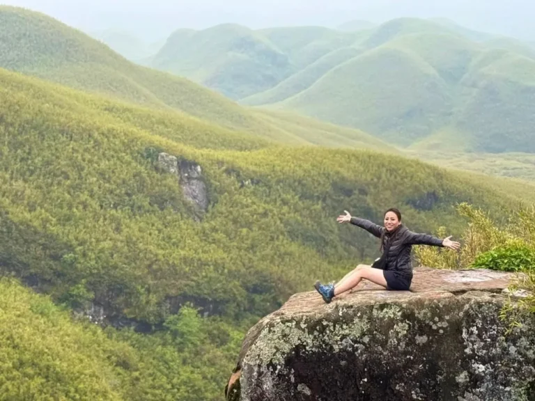 Girl enjoying the view at Dzukou Valley