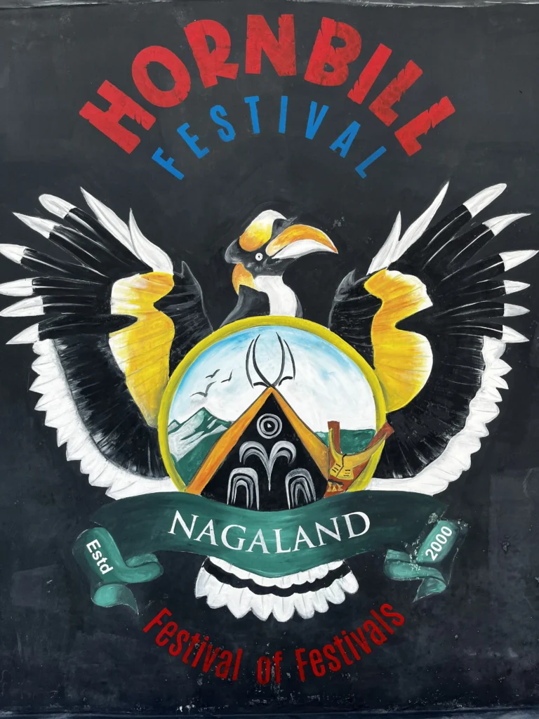 Hornbill Festival logo with a hornbill bird, traditional house, and Nagaland text