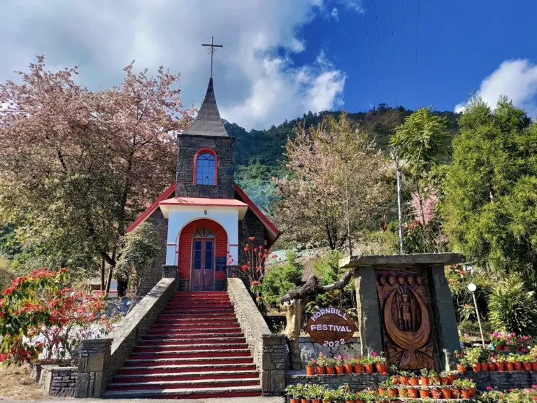 Kisama Church surrounded by flowers and trees during Hornbill Festival