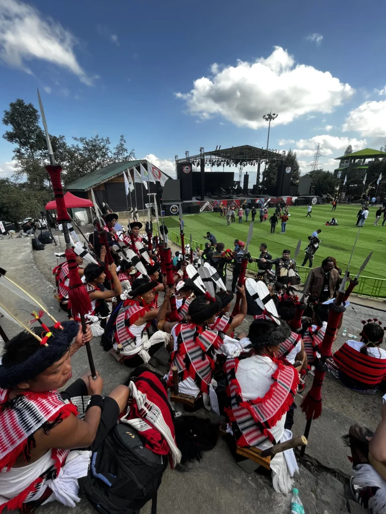 Performers in traditional attire at Hornbill Festival arena