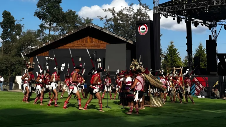 Tribal performers in traditional attire dancing at the Hornbill Festival stage